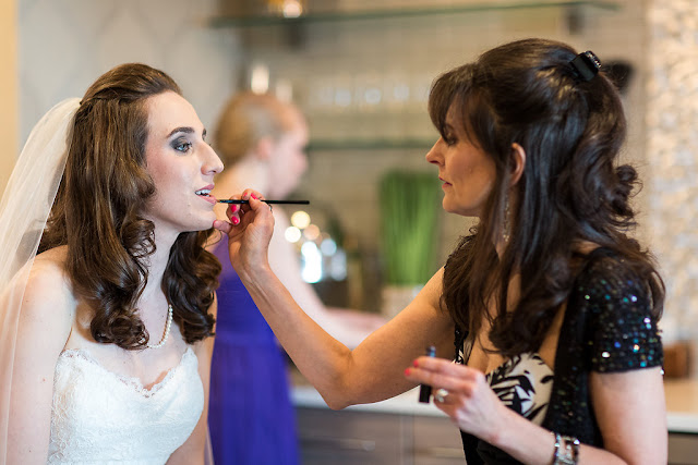 jill suzanne makeup artist applying bridal makeup