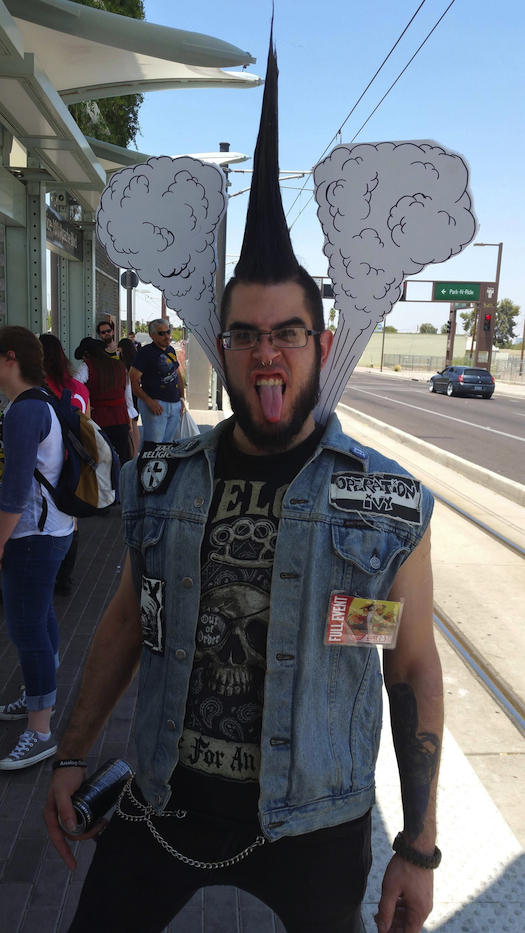 Man dressed as a punk in denim and a mohawk with cartoon steam coming off of him. A steampunk cosplay pun that's a funny costume for men and women