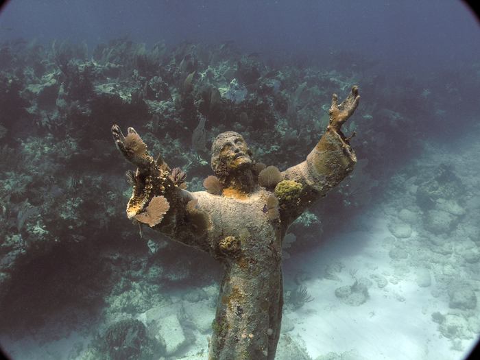 Christ of the Abyss is a submerged bronze statue of Jesus, of which the original is located in the Mediterranean Sea off San Fruttuoso between Camogli and Portofino on the Italian Riviera. It was placed in the water on 22 August 1954 at approximately 17 metres depth, and stands c. 2.5 metres tall. Various other casts of the statue are located in other places worldwide, both underwater and in churches and museums. The sculpture was created by Guido Galletti after an idea of Italian diver Duilio Marcante. The statue was placed near the spot where Dario Gonzatti, the first Italian to use SCUBA gear, died in 1947. It depicts Christ offering a blessing of peace, with his head and hands raised skyward.