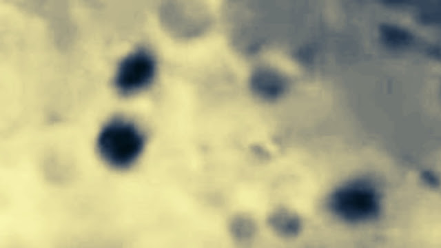 Three-UFOs-are-filmed-flying-in-formation-across-the-Moon-in-this-enhanced-image.