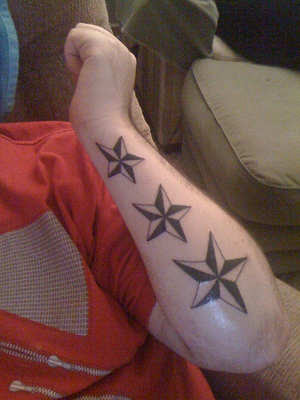 Nautical Star Tattoos on arm