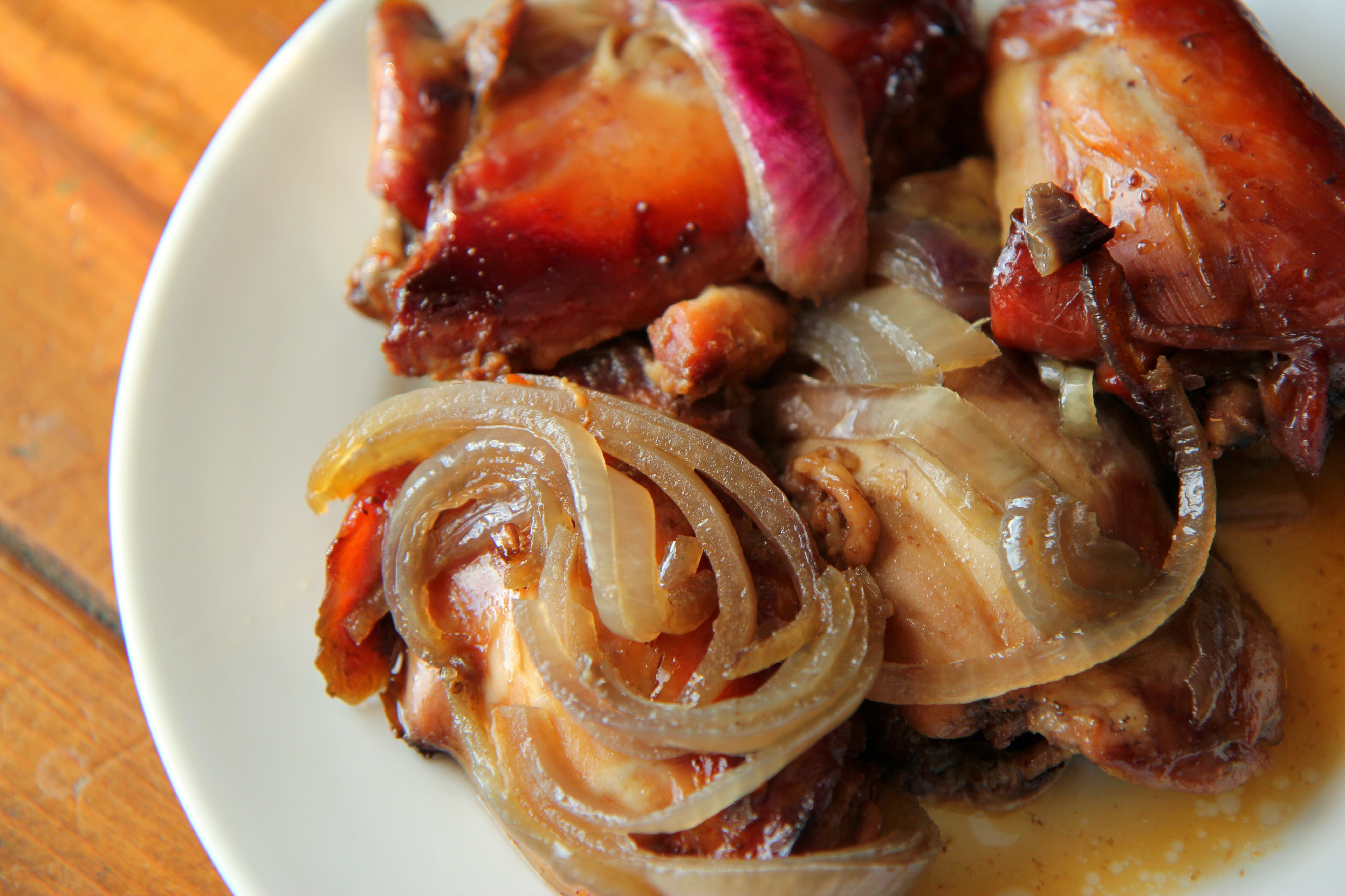 This slow-cooker chicken thigh recipe features beautiful red onion and strawberry jam!