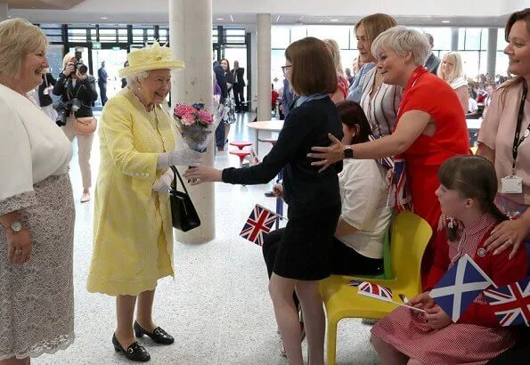 The traditional 'Ceremony of the Keys' took place tonight at Holyroodhouse in Edinburgh. yellow dress, jcoat and hat