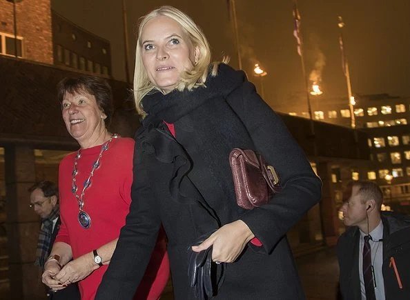 Crown Princess Mette-Marit wore Red valentino Ruffle Coat and Dolce and Gabbana Contrast stitch cady dress