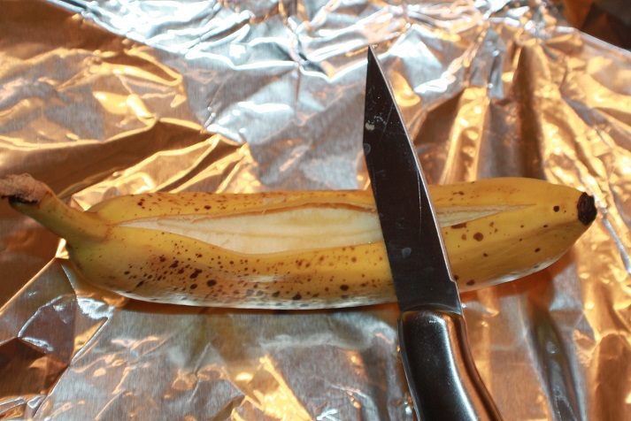 this is a banana being sliced for making an air fried dessert