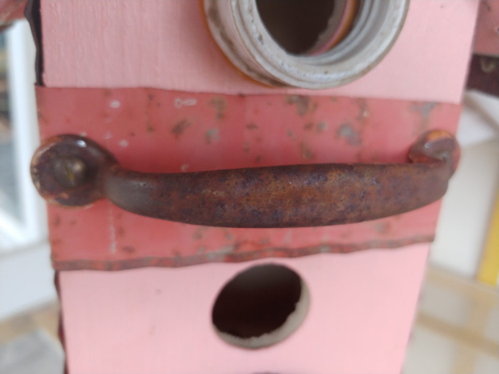 rusty handle birdhouse perch