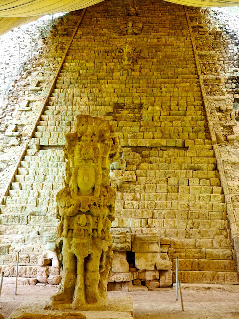 Stone staircase and Mayan statue at the temple ruins outside Copan, Honduras