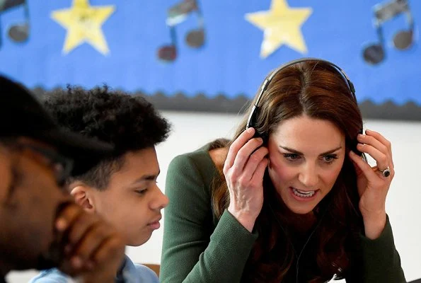 Kate Middleton in a custom forest green Emilia Wickstead dress, Mulberry bag and Gianvito Rossi heels