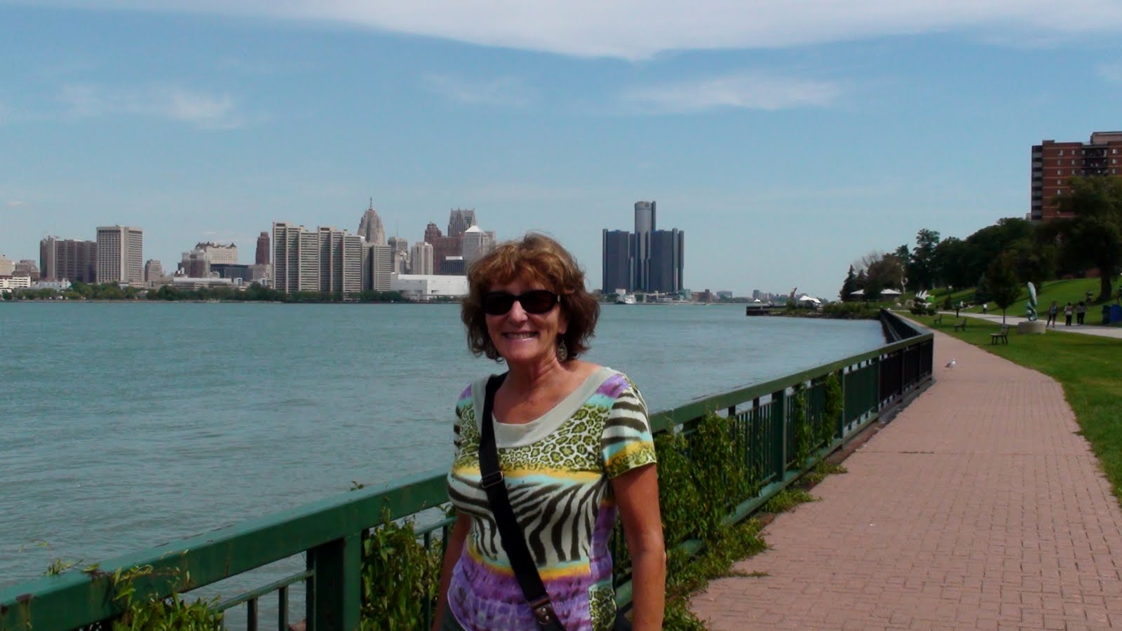 Liz in Winsdor Ontario looking across the Detroit River to Detroit, Michigan, USA.