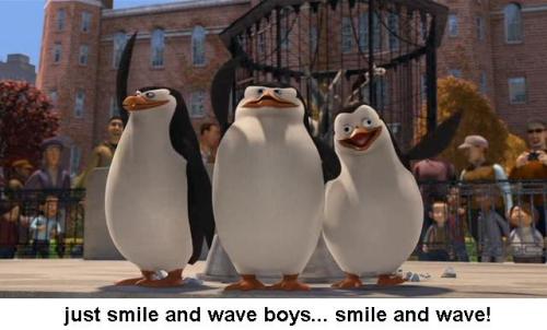 Penguins waving and smiling at the camera