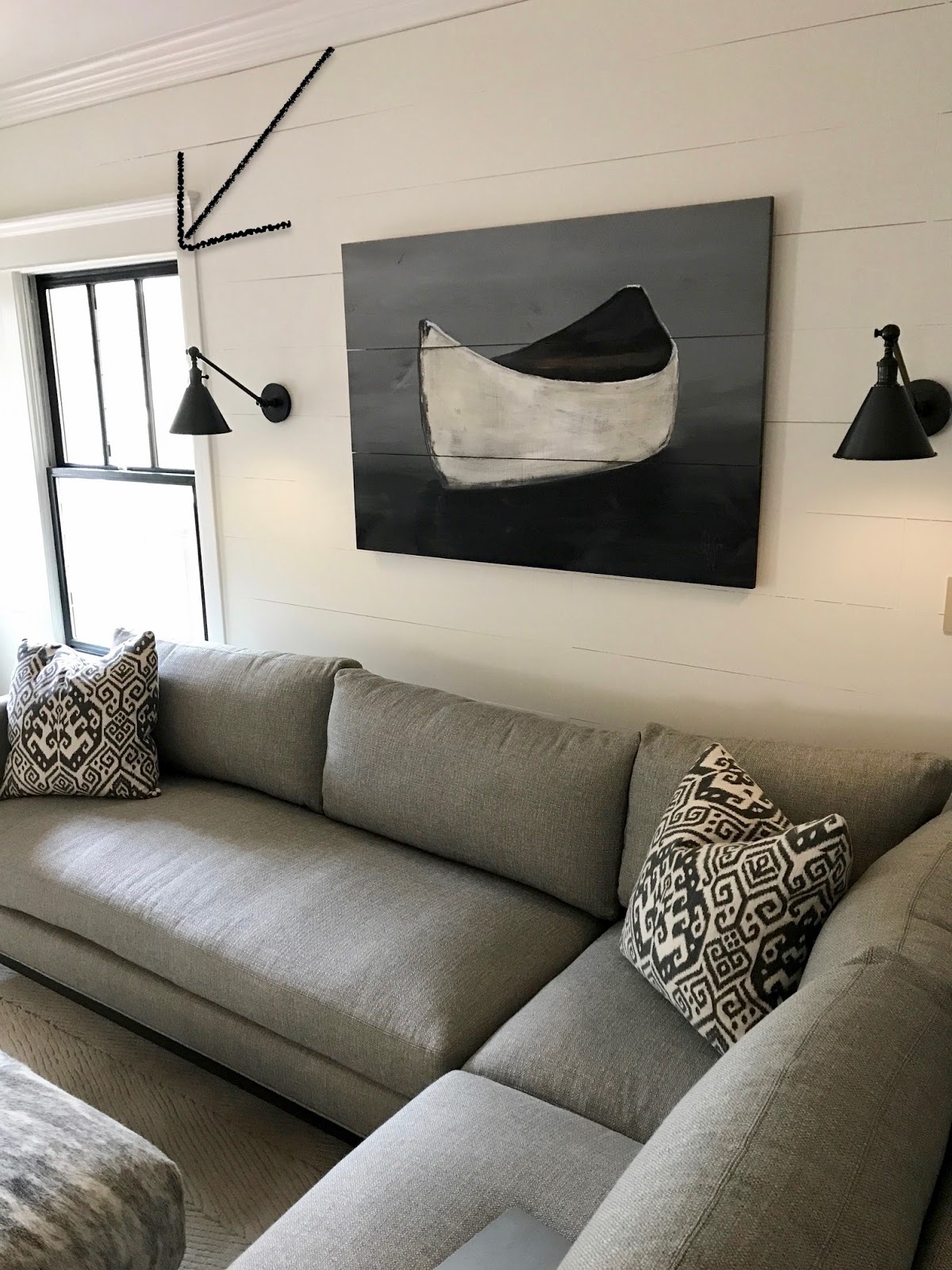 Dark Gray Sofa, Ship lap walls, and retractable farmhouse sconces
