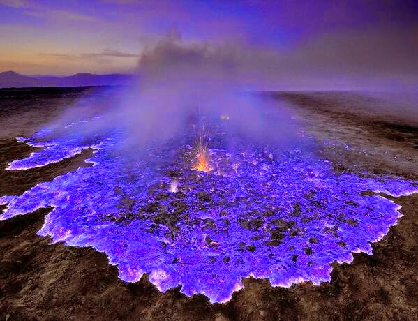 Spectacular Neon Blue Lava Pours From Indonesia's Kawah Ijen Volcano