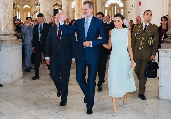 Queen Letizia wore Adolfo Dominguez embroidered cotton dress with belt. Letizia wore a new aquamarine blue midi dress