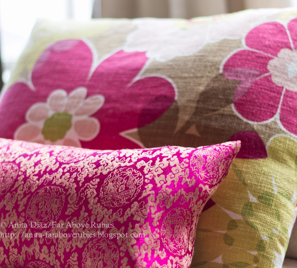 Pink pillows and a modern print