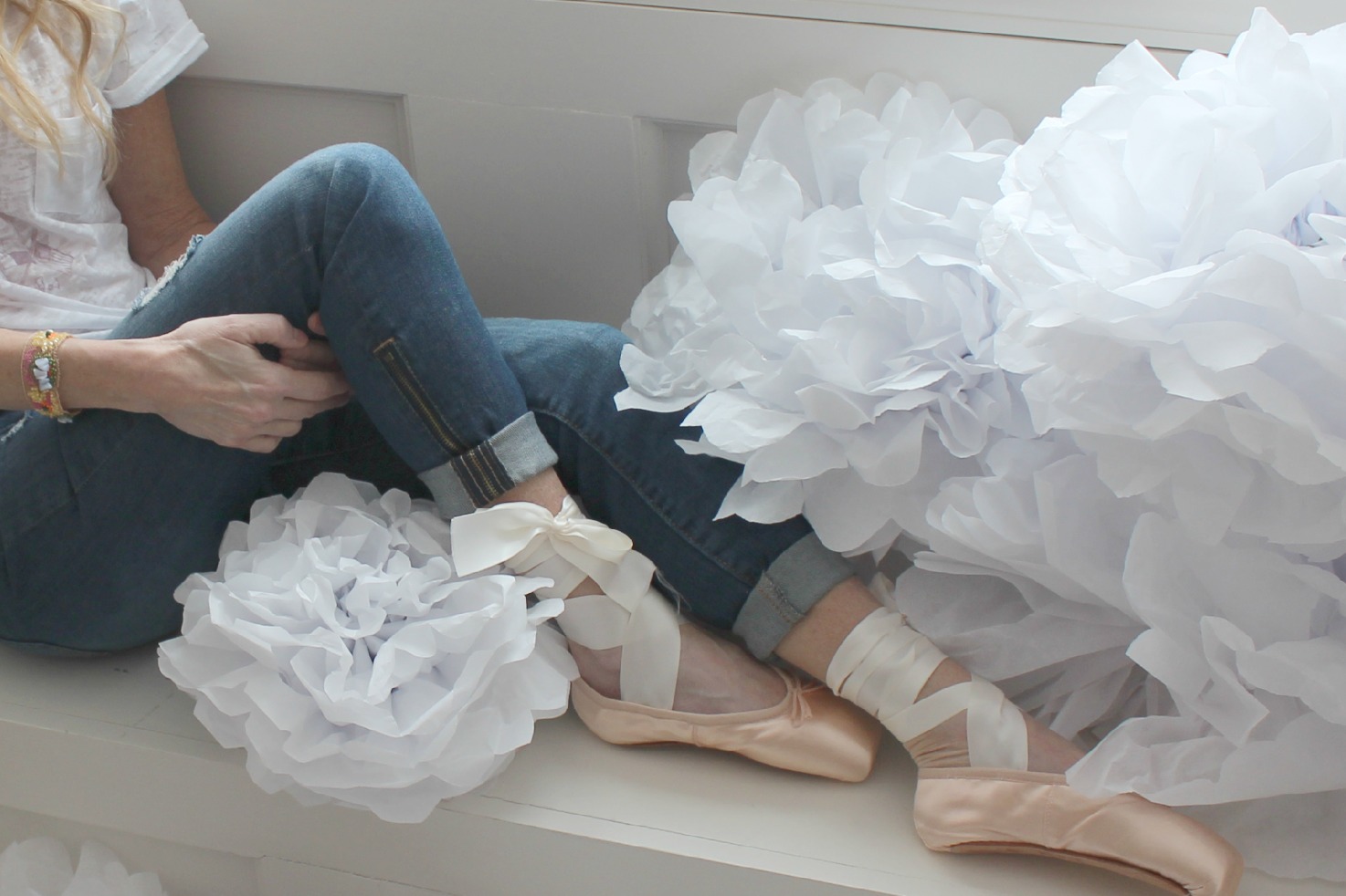 Michele of Hello Lovely Studio in pointe shoes with tissue poufs