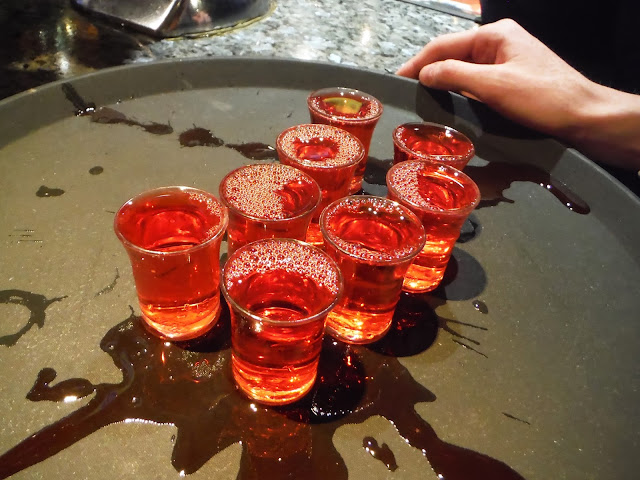 a tray full of cherry sour shots