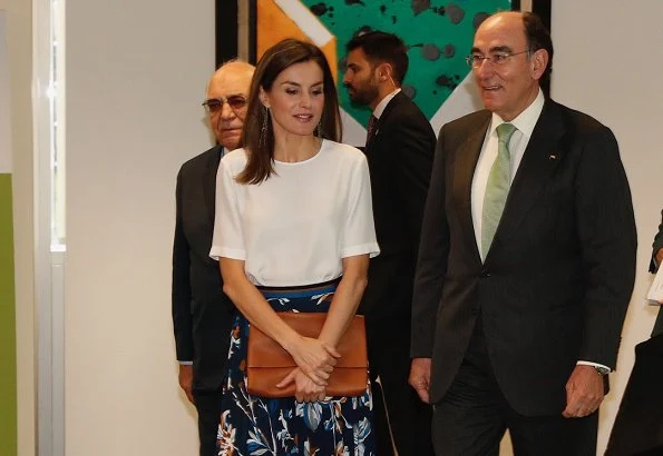 Queen Letizia wore HUGO BOSS Viplisa Skirt and Magrit pumps, Queen Letizia carried Hugo Boss clutch bag at Iberdrola Headquarters