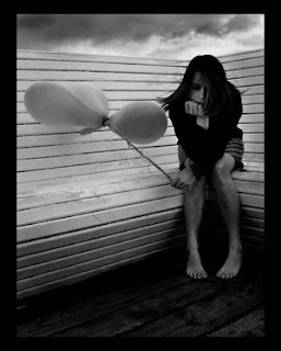 lonely girl with balloons