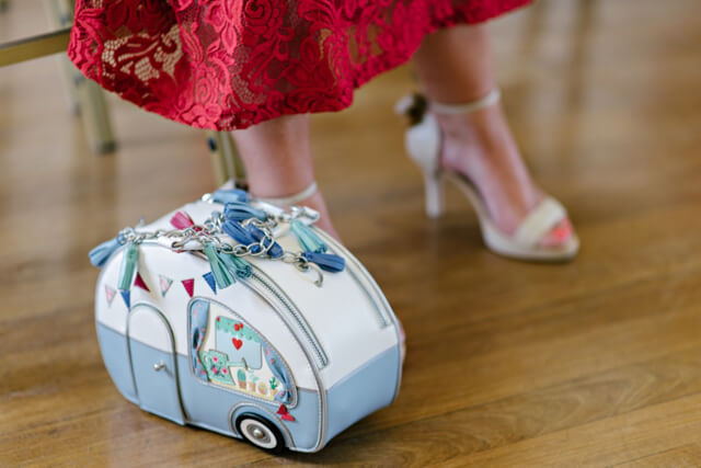 Vendula London caravan bag at vintage seaside wedding Vendula London caravan bag at vintage seaside wedding