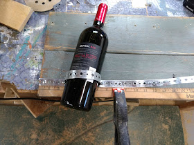 use plumbers tape to make wine holders