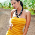 Denise Milani lifts up her yellow tube dress outside