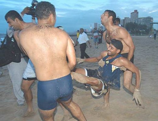 funny images of cricket players. Indian team players doing funny things in the sand on beach