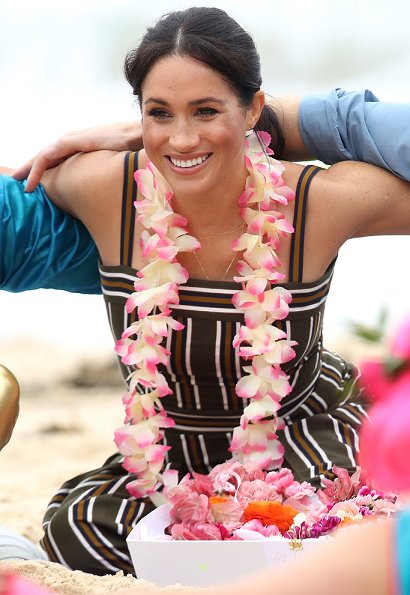 Meghan Markle wore Martin Grant Pleated Stripe Long Dress. The Duke and Duchess of Sussex visited Bondi Beach
