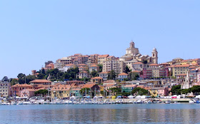 The waterfront of the Ligurian port city of Imperia, with the Basilica of San Maurizio on top of the hill