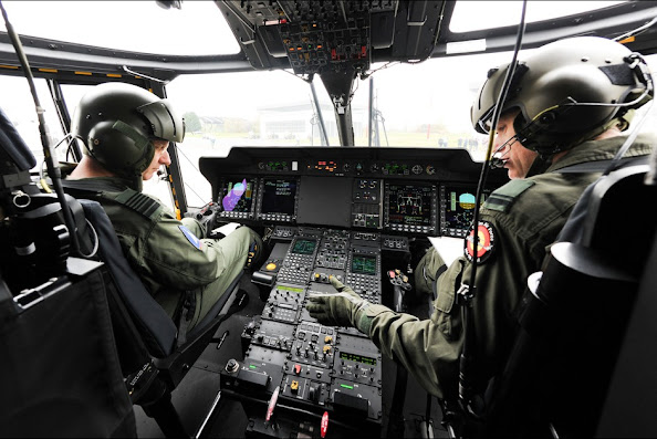 Belgium's King Philippe is pictured at the command of a NH90 helicopter during a visit to the Beauvechain Air Base
