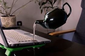 PHOTO CREDIT: Roman Czarny ,"White Kettle Droping Water on Silver Laptop Computer"; posted at Pexels ("https://www.pexels.com/photo/laptop-guide-computer-levitation-74039/ : downloaded 3 Feb 2017); used under Creative Commons Zero (CC0) License.