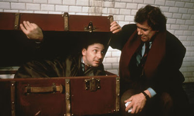 Zbigniew Zamachowski as Karol Karol (with his Pole friend Mikoaj), hides in the suitcase, Three Colors: White, Directed by Krzysztof Kieslowski