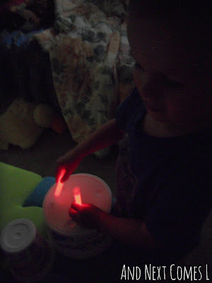 Drumming with glow sticks from And Next Comes L