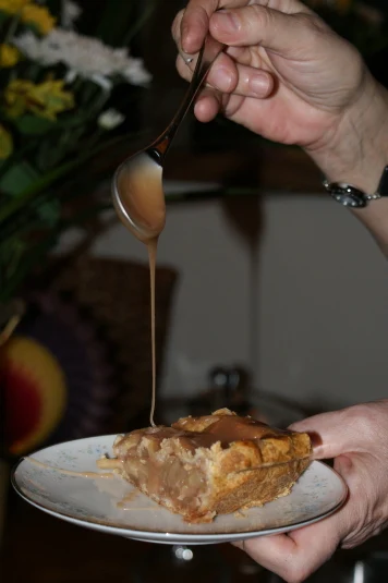 Drizzling caramel over a slice