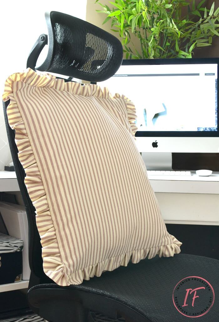Recycled red ticking fabric office chair pillow for added back support.