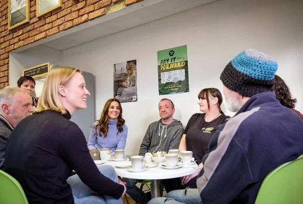 Kate Middleton wore a gray knit turtleneck, black skinny jeans, a khaki Barbour jacket, and knee-high Penelope Chilver boots