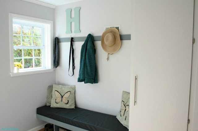 See how I transformed a dark basement entry way into a beautiful bright mudroom in just a few weeks.