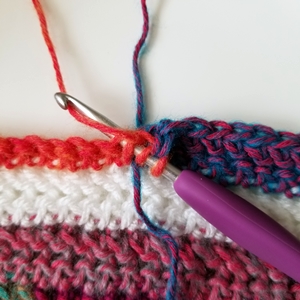 How to make a tidy color change across a row when picking up a new color from below in crochet