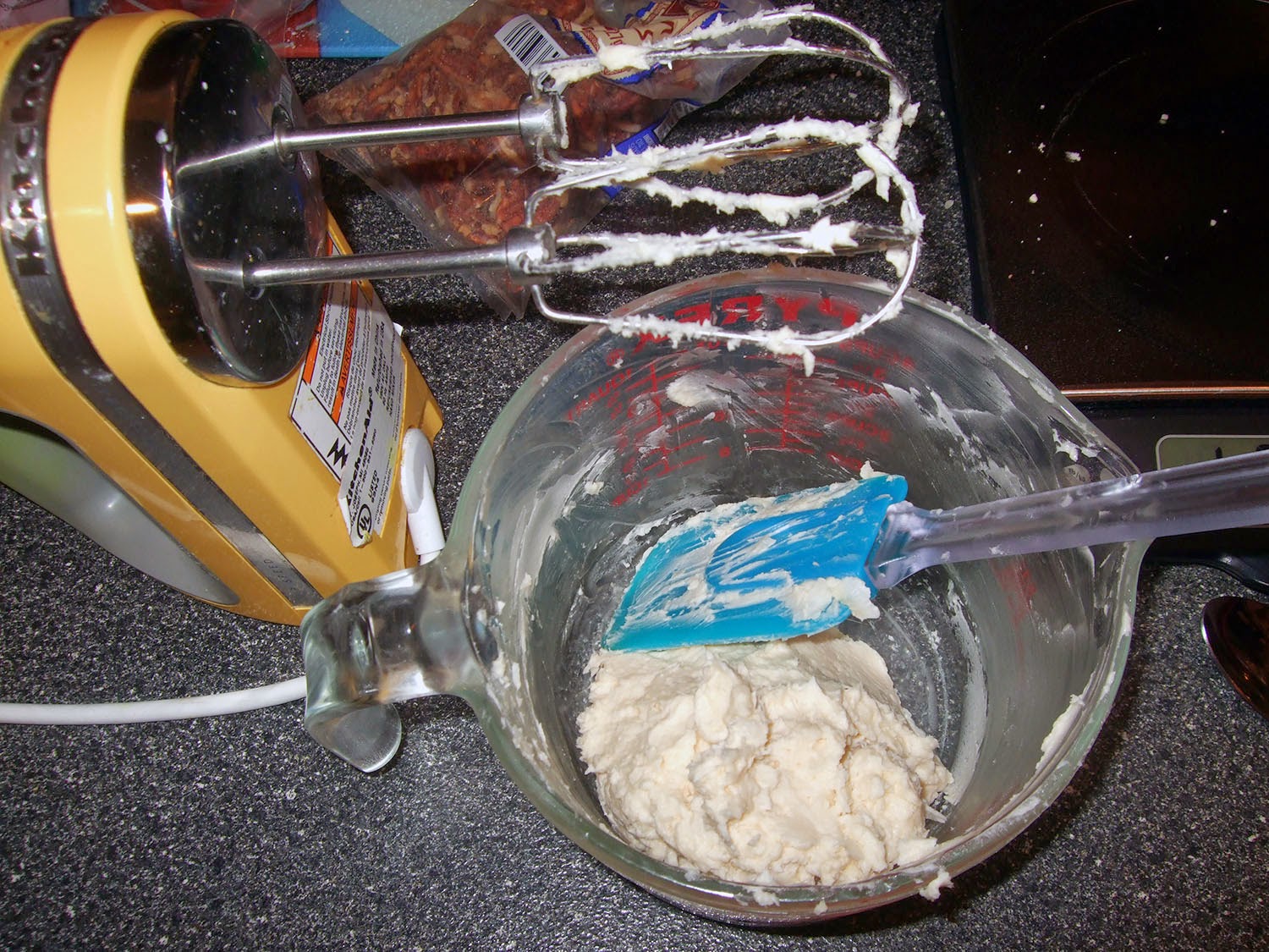 Frosting in mixing cup.