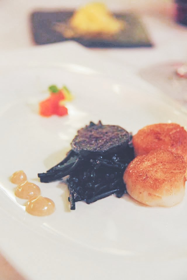 Fideua negra with roasted scallops, angulas, blood sausage, peppers, and anchovy Fideua negra with roasted scallops, angulas, blood sausage, peppers, and anchovy