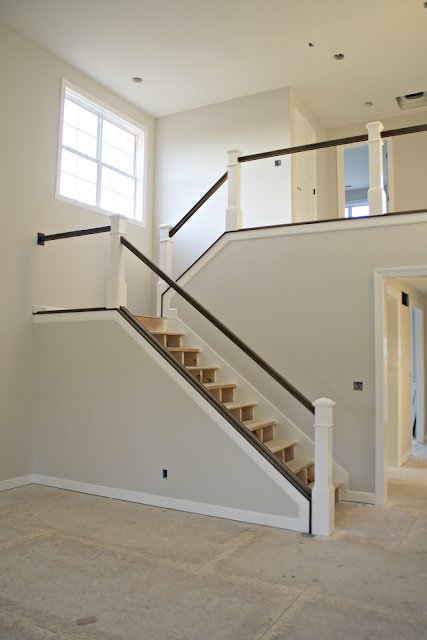 dark stair railings with white balusters