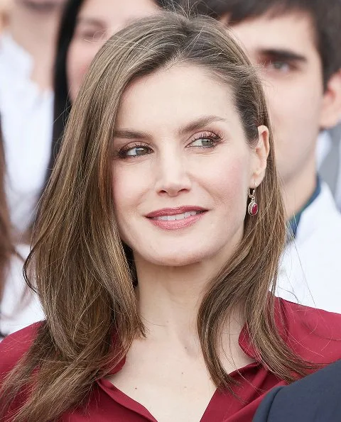 Queen Letizia wore Felipe Varela blouse and floral skirt, Felipe Varela clutch bag, Magrit pumps. National Centre for Technology and Food Safety