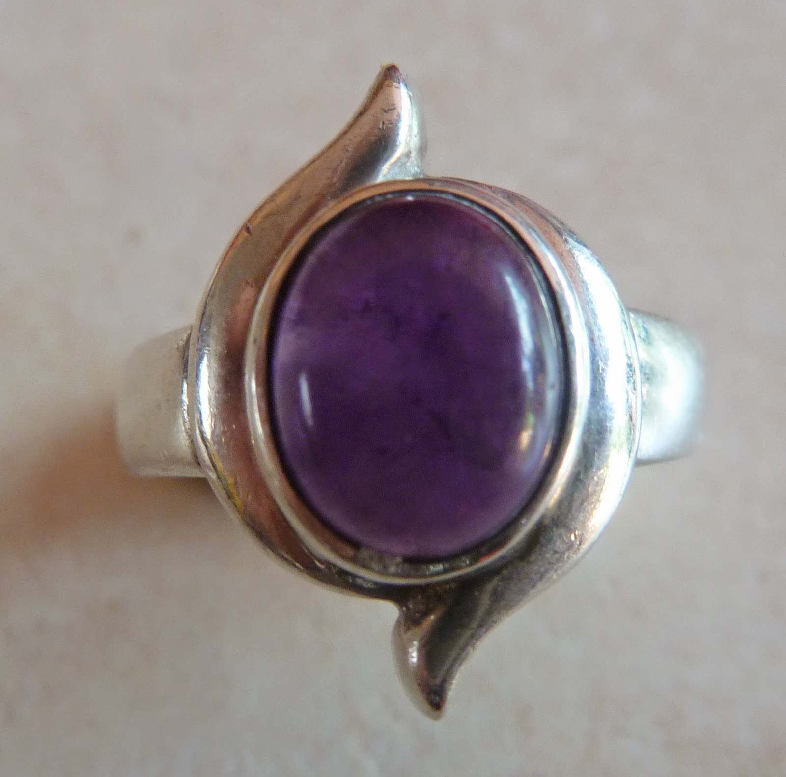 http://www.kcavintagegems.uk/sterling-silver-and-amethyst--modernist-style-vintage-ring-67-p.asp
