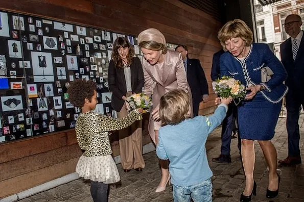 Queen Mathilde of Belgium and Daniela Schadt, partner of German President meet students of the Antwerp Fashion Academy during a visit to the MoMu fashion museum