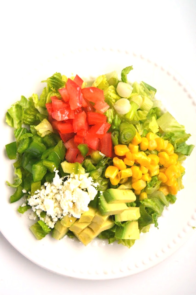 This Avocado, Corn and Feta Chopped Salad gives you a burst of each flavor in every bite! Ready in 5 minutes, it makes the perfect salad to accompany any meal! www.nutritionistreviews.com