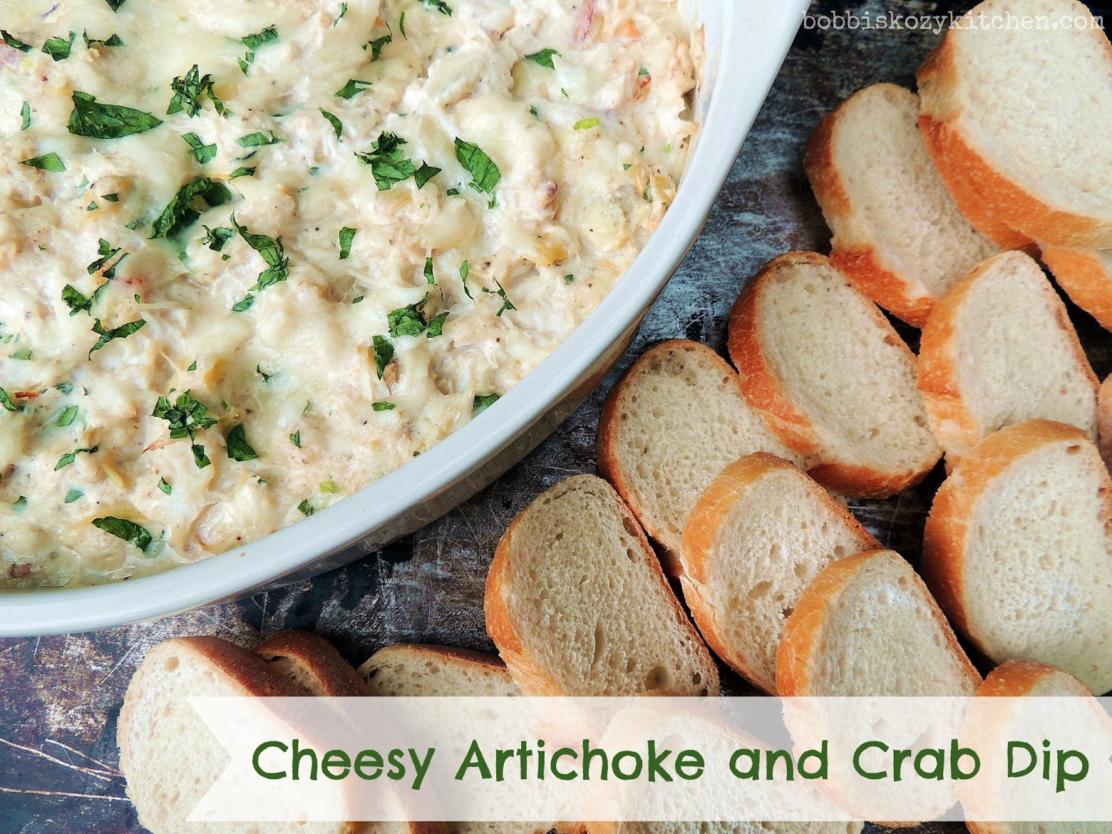 If you are looking for an appetizer that is sure to impress, this Cheesy Artichoke Crab Dip is it. Warm and cheesy, with tender artichoke hearts and luscious crab, your guests will be fighting for the last bite! From www.bobbiskozykitchen.com #appetizer, #crab #dip