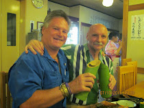 FWT and American English Profesor Randy Bollig toasting with sake in Japanese Restaurant, Kobe