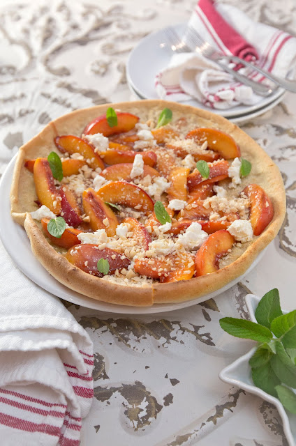 Dutch Baby Pancake with Nectarines, Marcona Almonds, Honey Goat Cheese, and Garden Mint