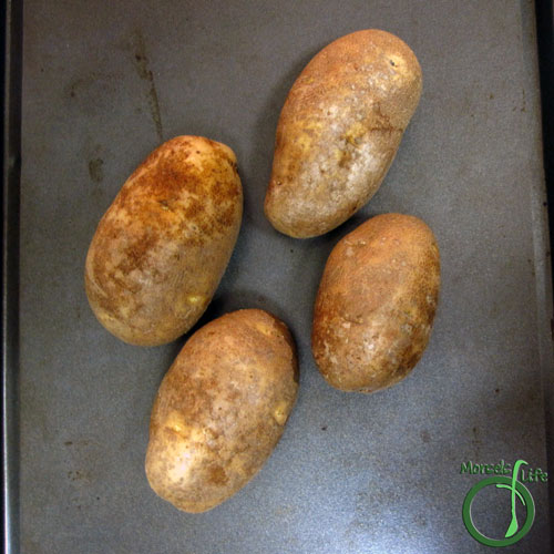 Morsels of Life - Twice Baked Potatoes Step 2 - Bake potatoes for 60 minutes at 350F, or until cooked through. I didn't pierce the skin beforehand because I thought it might make scooping out the insides more difficult later on. Sarah did, and it looks like it worked, so it's up to you. :)