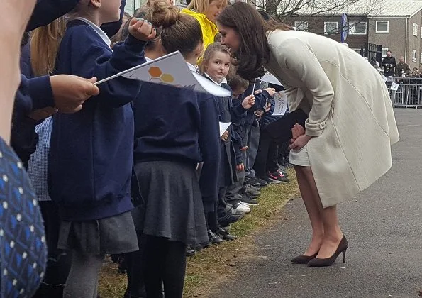 Kate Middleton wore JoJo Maman Bebe Maternity Princess Coat, with her Annoushka pearls and Kiki McDonough hoops and carried suede Emmy clutch