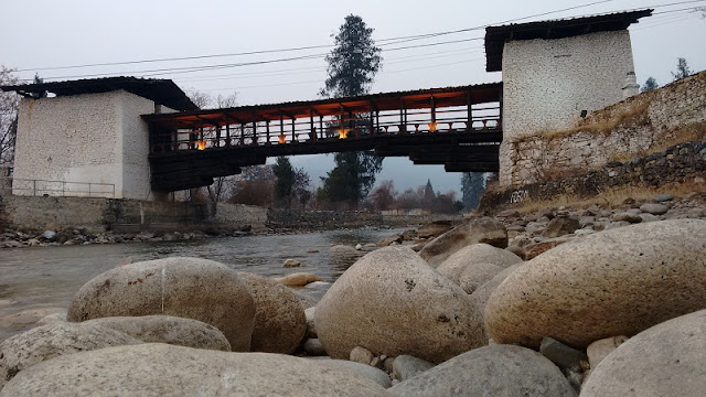 Wooden bridge on the Paro Chuu River beside Rinpung Dzong in Paro, Bhutan